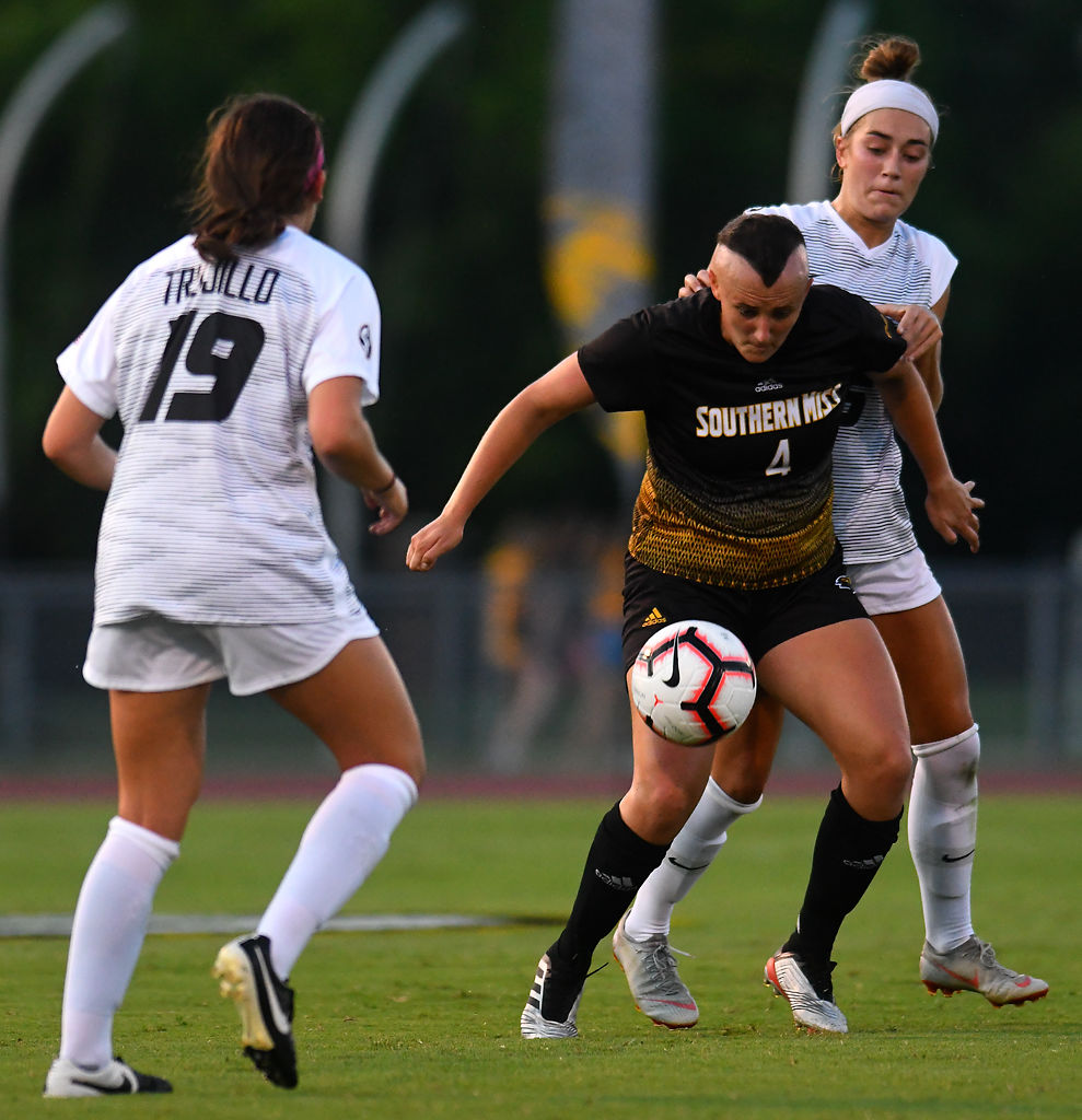 Southern Mississippi forward Hailey Pohevitz boxes out Missouri defender